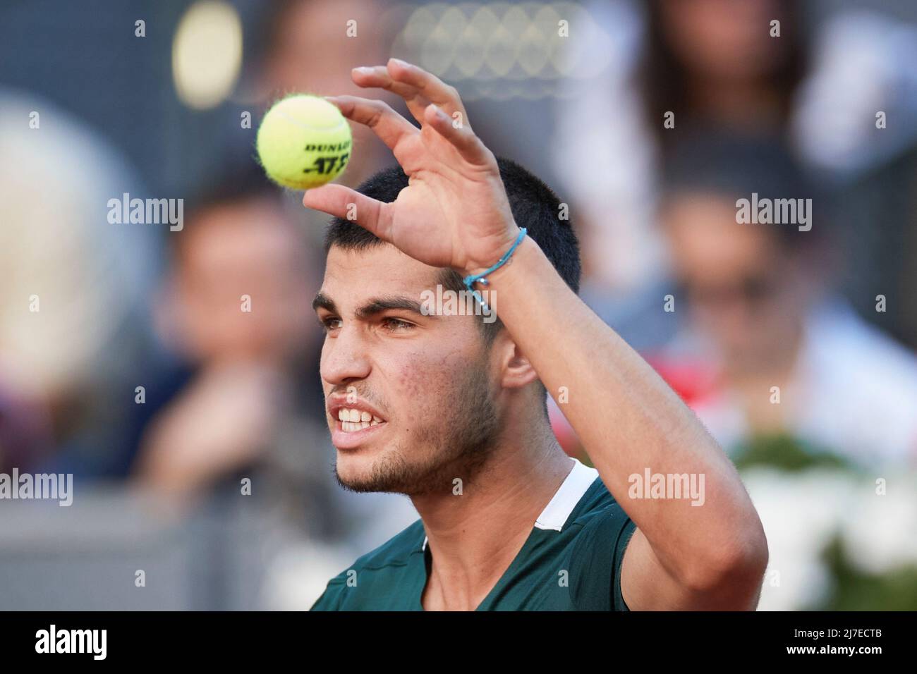 MADRID, May 9, 2022 (Xinhua) -- Carlos Alcaraz of Spain reacts during the men's singles final against Alexander Zverev of Germany at the Madrid Open in Madrid, Spain, May 8, 2022. (Xinhua/Meng Dingbo) Stock Photo