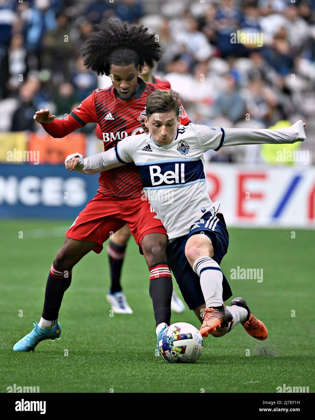 VANCOUVER, May 9, 2022 (Xinhua) -- Jayden Nelson (L) of Toronto FC and Ryan Gauld of Vancouver Whitecaps compete during their MLS regular season football match in Vancouver, Canada, May 8, 2022. (Photo by Andrew Soong/Xinhua) Stock Photo