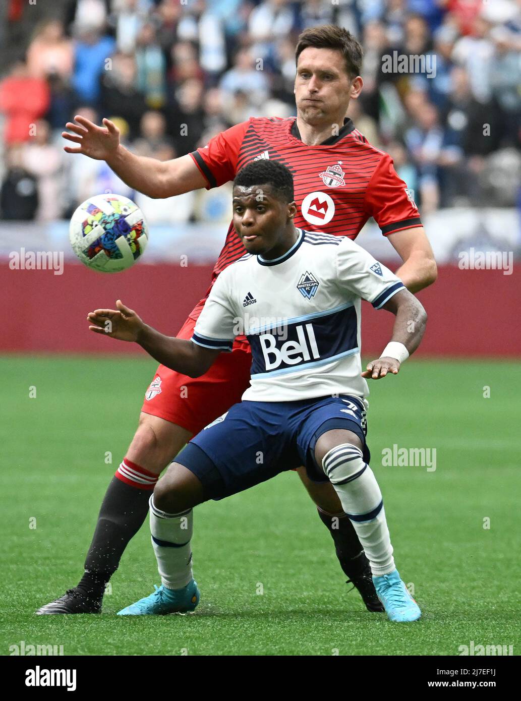 VANCOUVER, May 9, 2022 (Xinhua) -- Shane O'Neill (top) of Toronto FC and Deiber Caicedo of Vancouver Whitecaps compete during their MLS regular season football match in Vancouver, Canada, May 8, 2022. (Photo by Andrew Soong/Xinhua) Stock Photo
