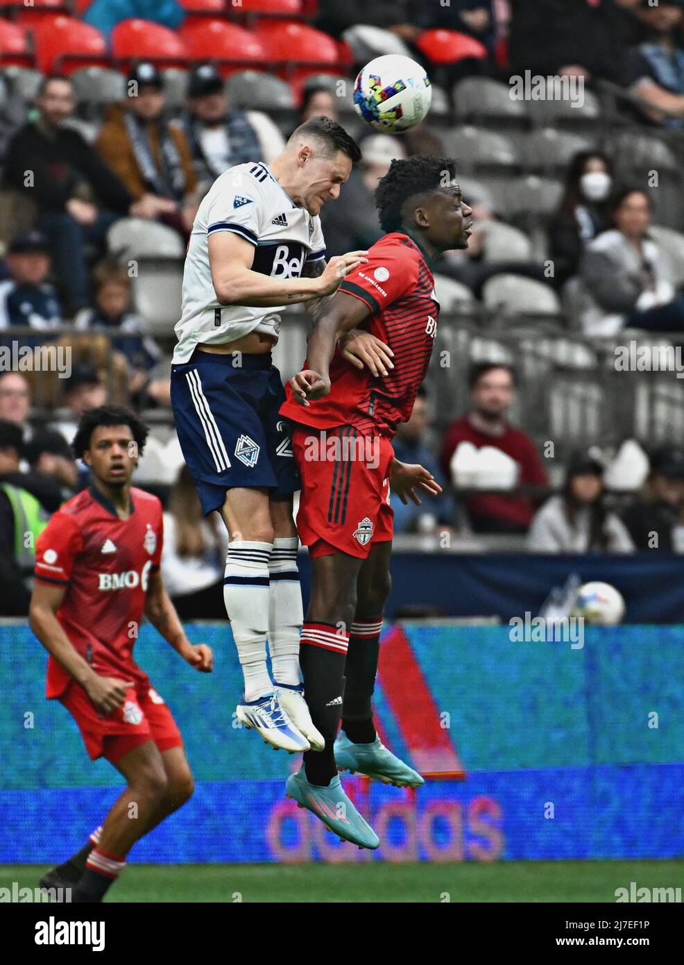 VANCOUVER, May 9, 2022 (Xinhua) -- Jake Nerwinski (2nd R) of Vancouver Whitecaps and Deandre Kerr of Toronto FC compete during their MLS regular season football match in Vancouver, Canada, May 8, 2022. (Photo by Andrew Soong/Xinhua) Stock Photo
