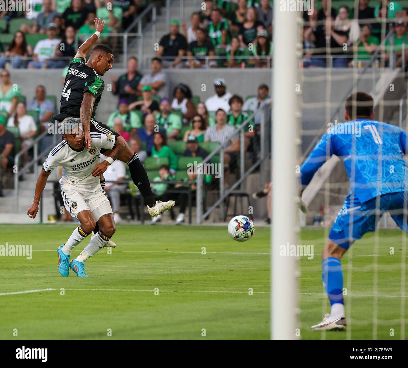 May 8, 2022: Austin FC defender Ruben Gabrielsen (4) leaps over Los Angeles Galaxy defender Julian Araujo (2) during the second half of a major league soccer match between Austin FC and the Los Angeles Galaxy on May 8, 2022 in Austin, Texas. (Credit Image: © Scott Coleman/ZUMA Press Wire) Stock Photo