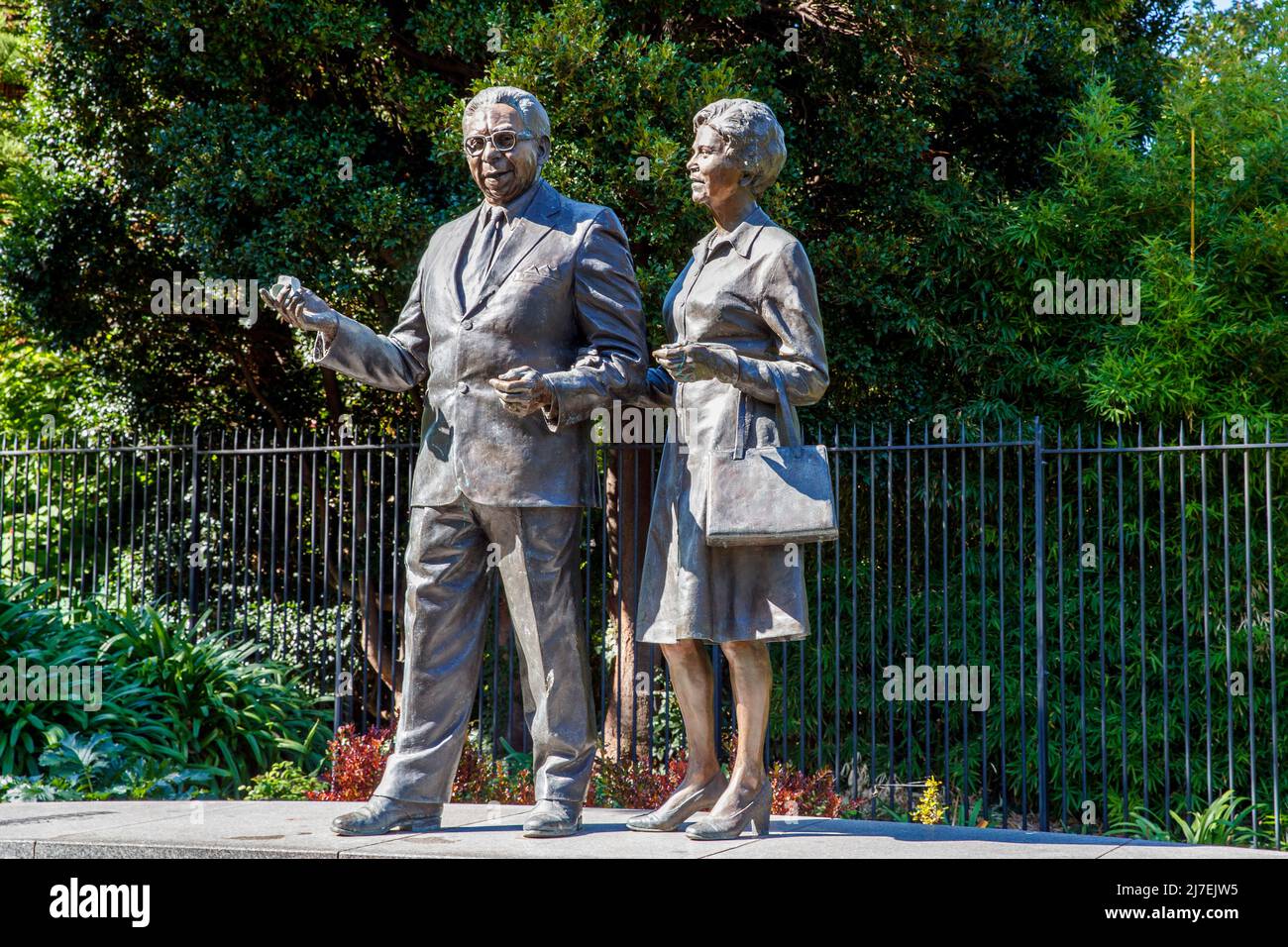 Bronze statues of Pastor Sir Douglas and Lady Gladys Nicholls in Parliament Gardens, Melbourne, Victoria, Australia on Saturday, April 16, 2022. Stock Photo