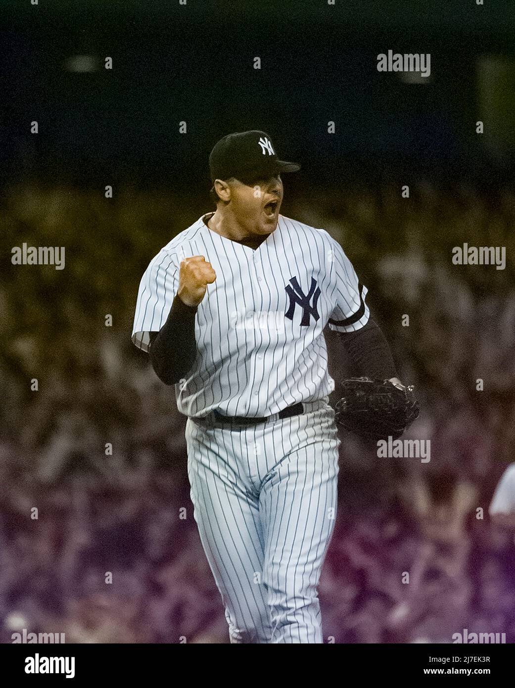 Yankees pitcher Roger Clemens pumps his fist during a game against the Boston Red Sox on May 28, 2000 in New York. Photo credit: Francis Specker Stock Photo