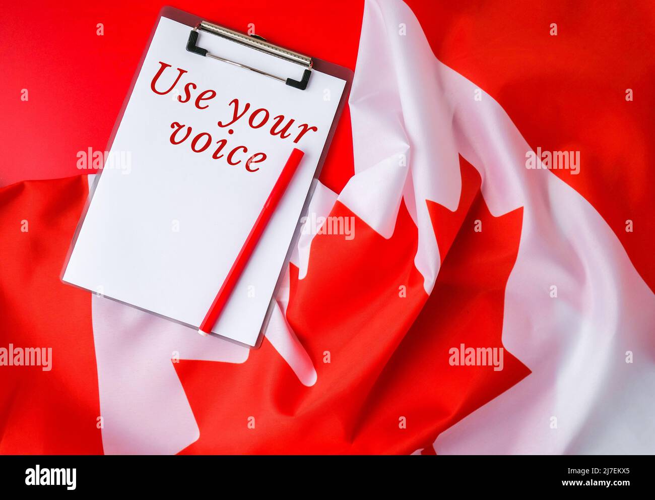 The National Flag of Canada. Canadian Flag or the Maple Leaf with paper note message text