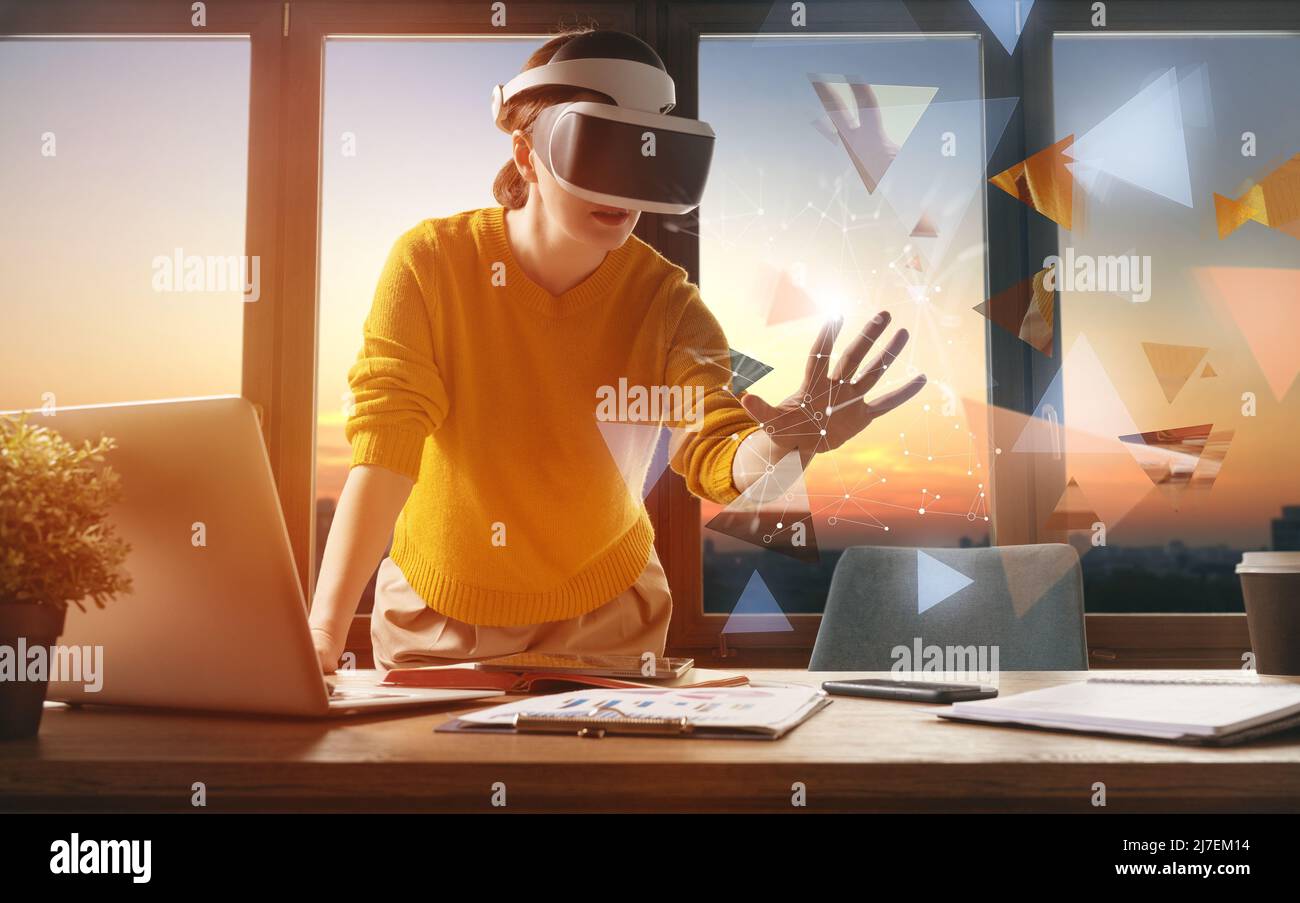 Metaverse technology concept. Woman with VR virtual reality goggles is ...