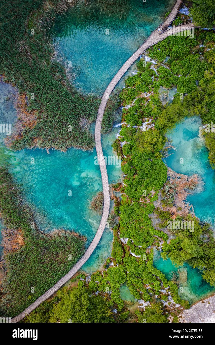 Plitvice, Croatia - Aerial top down view of a wooden walkway in Plitvice Lakes National Park on a bright summer day with turquoise water and small wat Stock Photo