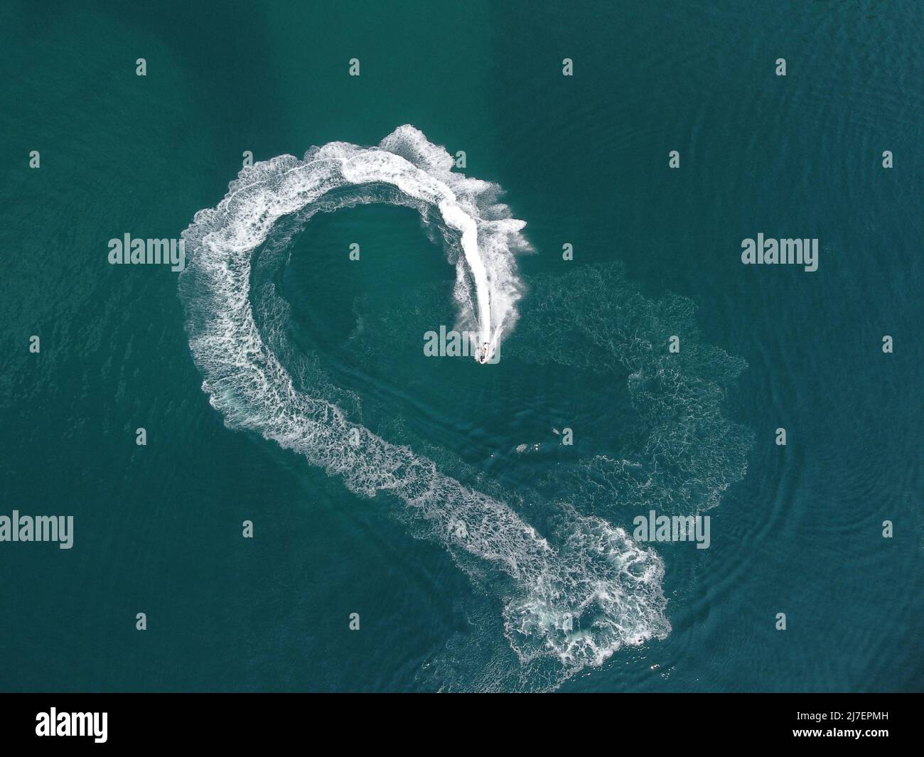 Aerial top down view of water foam trace with nice deep blue shade of ...