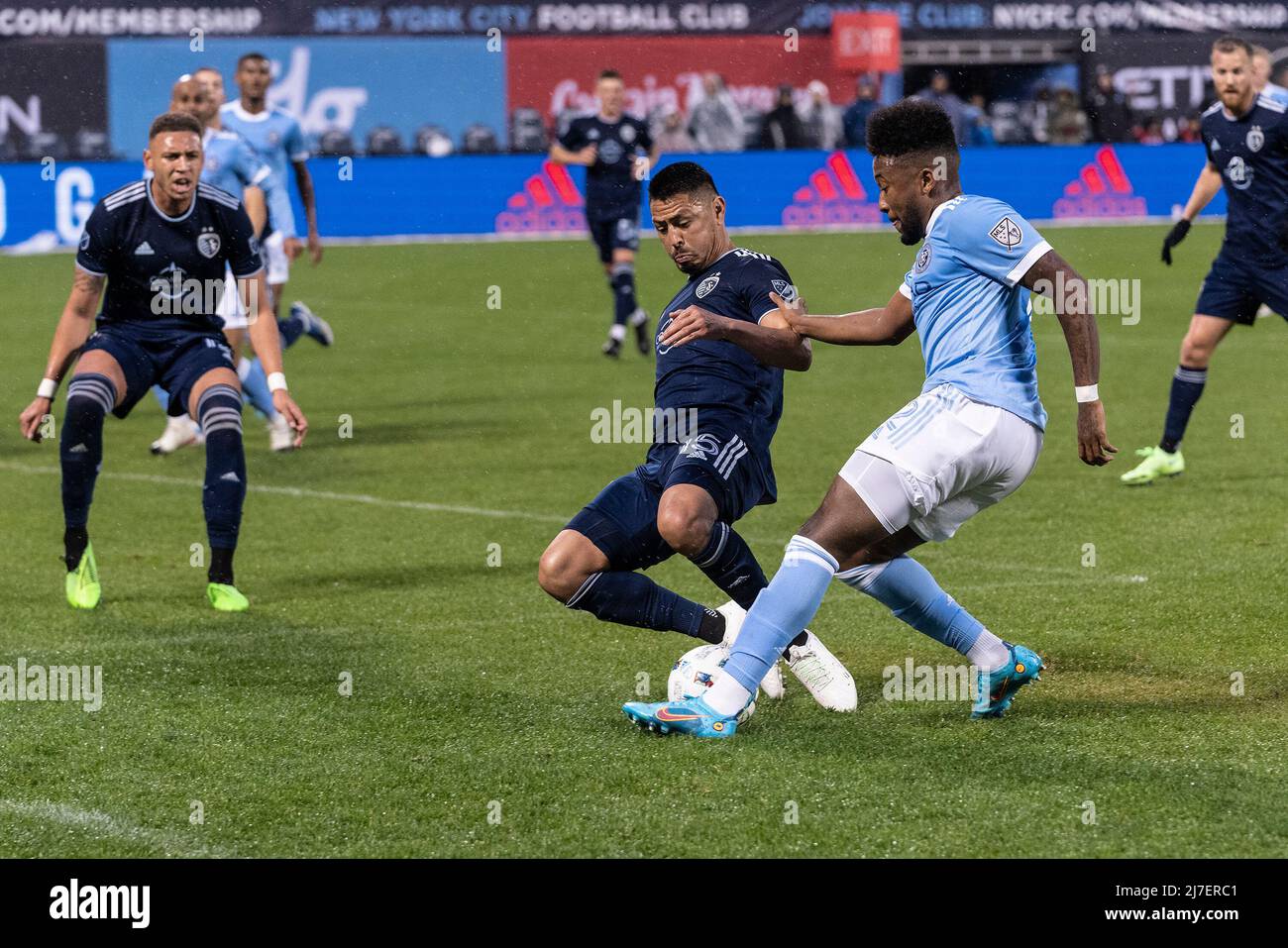 May 7, 2022, New York, New York, United States: Roger Espinoza (15) of Sporting Kansas City and Chris Gloster (2) of NYCFC fight for the ball during regular MLS game at Citi Field. Game ended in goalless draw. (Credit Image: © Lev Radin/Pacific Press via ZUMA Press Wire) Stock Photo