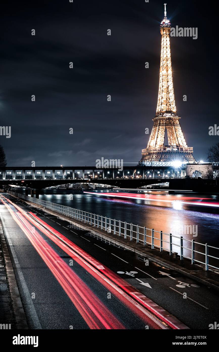 The Eiffel Tower at Night as seen from the Seine Stock Photo