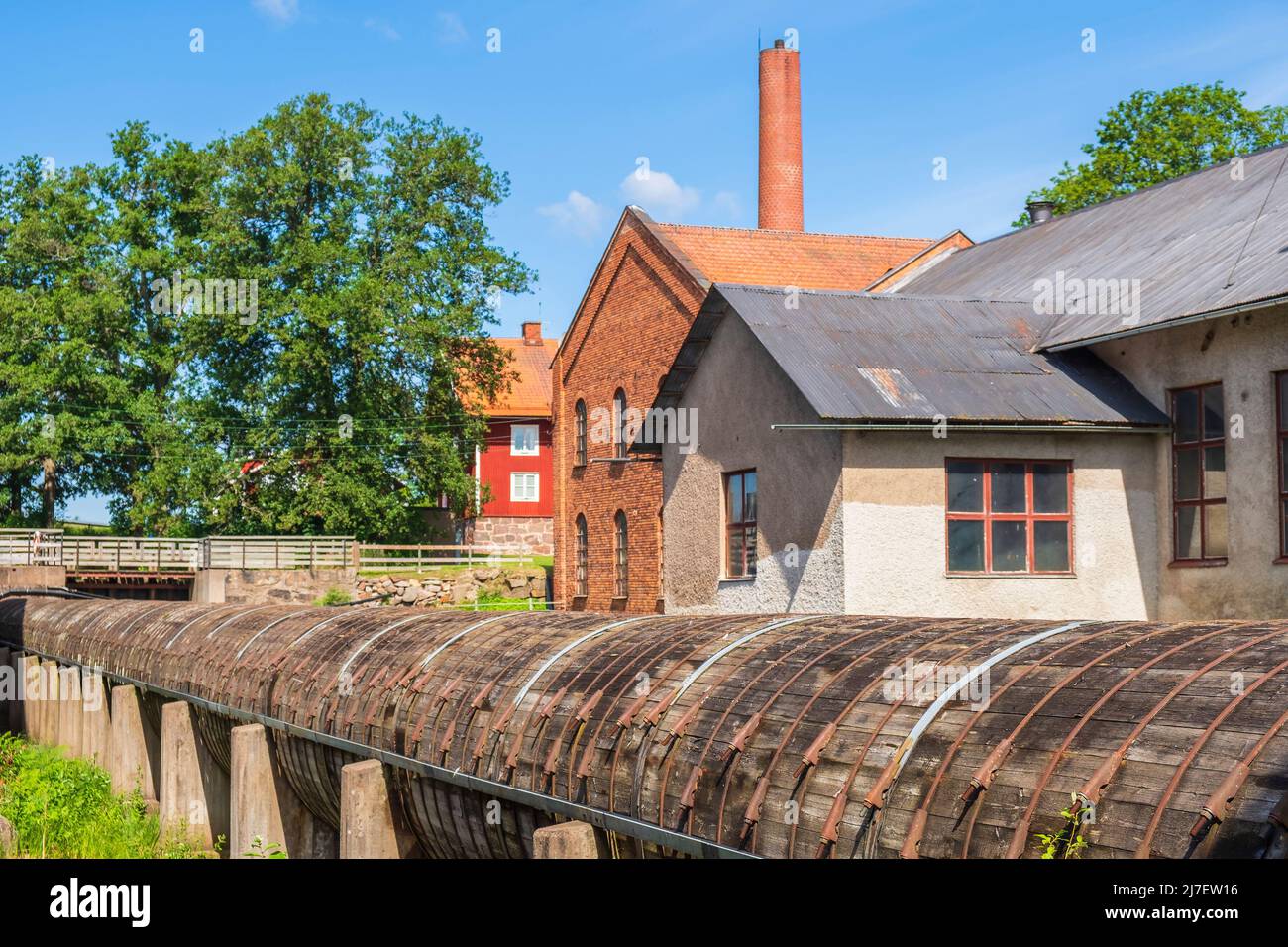 Wooden water tube in an old factory area Stock Photo - Alamy