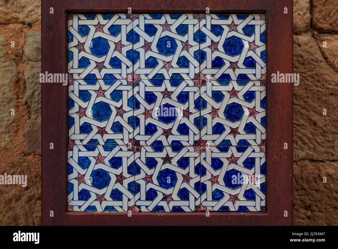 Close up details of a traditional Moroccan Zellige tile pattern mosaic in Olite, Spain famous for a magnificent Royal Palace castle Stock Photo