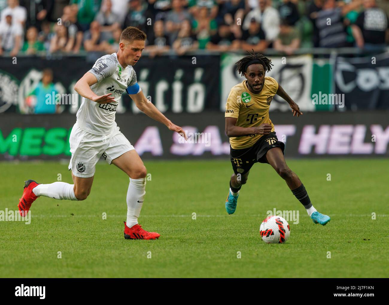 BUDAPEST, HUNGARY - AUGUST 29: (l-r) Tokmac Chol Nguen of Ferencvarosi TC  celebrates his goal in front of Gergo Lovrencsics of Ferencvarosi TC during  the UEFA Europa League Play-off Second Leg match
