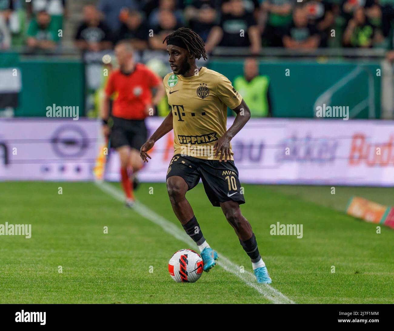 BUDAPEST, HUNGARY - MAY 4: Ihor Kharatin of Ferencvarosi TC #14 blocks the  shot from Vincent Onovo of Ujpest FC (l) before Tokmac Chol Nguen of Ferencvarosi  TC #92 during the Hungarian