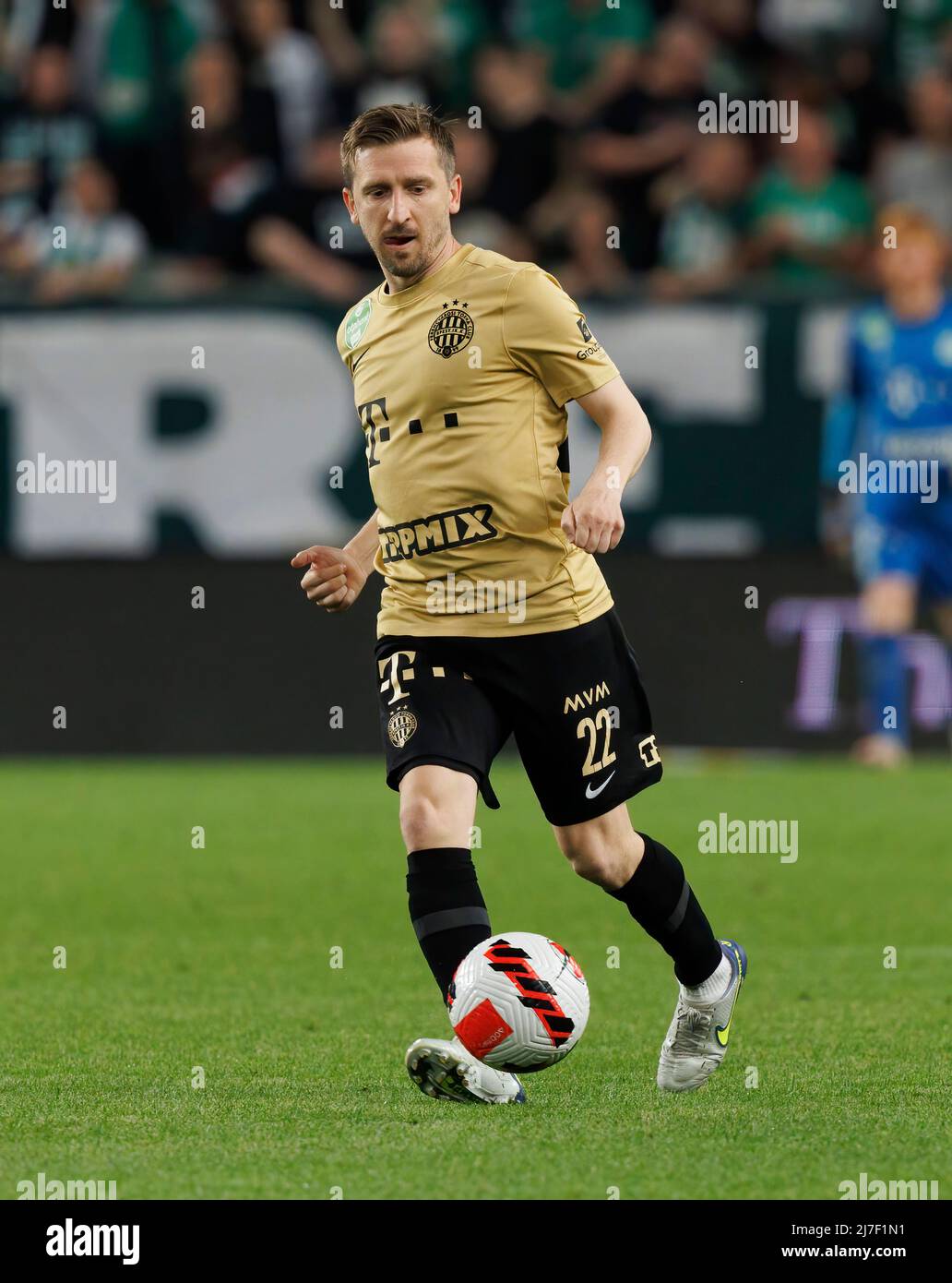BUDAPEST, HUNGARY - MAY 7: Muhamed Besic of Ferencvarosi TC runs with the  ball during the Hungarian OTP Bank Liga match between Ferencvarosi TC and  MTK Budapest at Groupama Arena on May