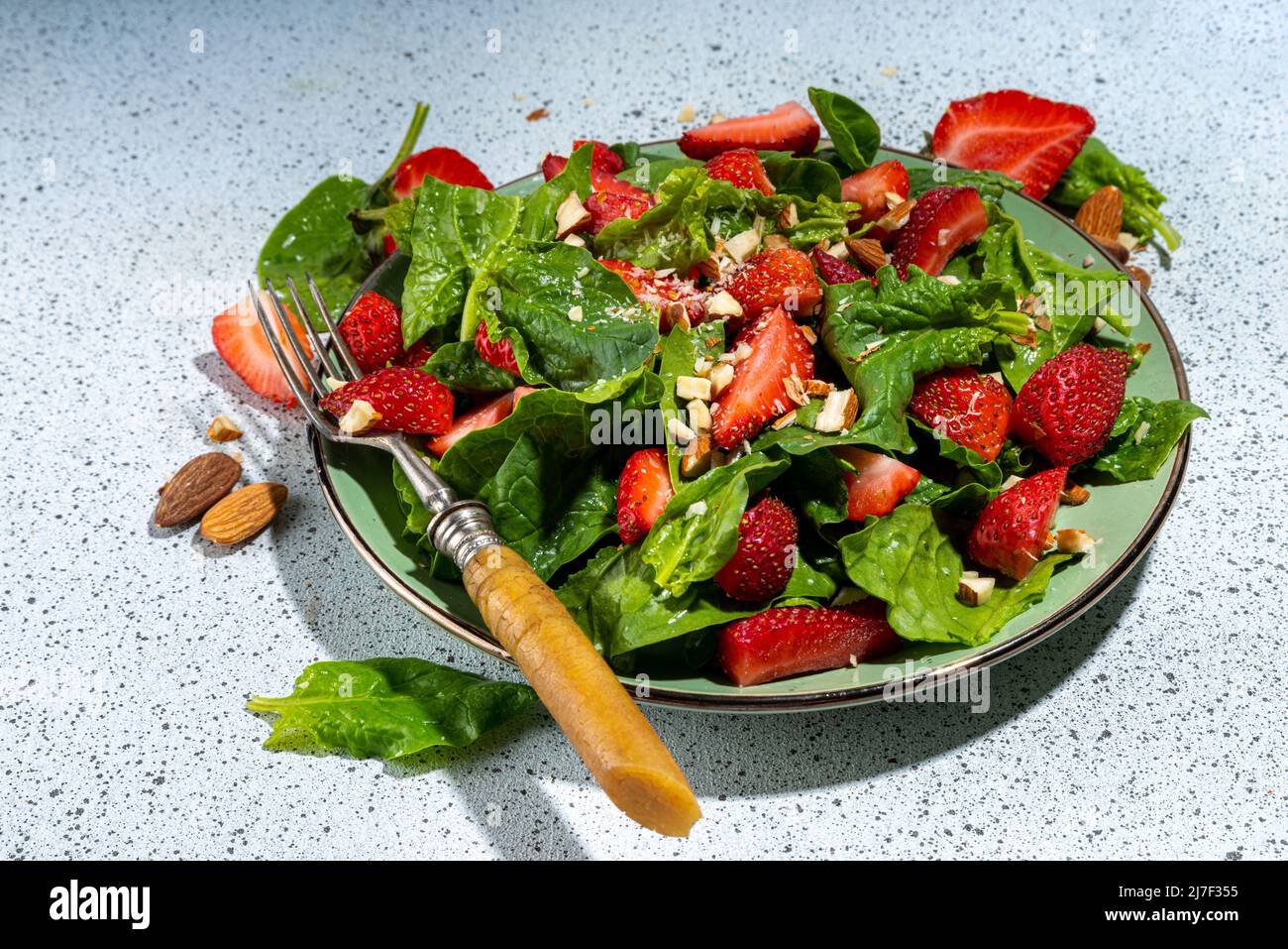 Strawberry, spinach and nuts salad. Healthy diet spring summer salad