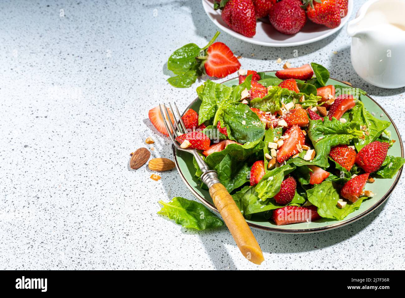 Strawberry, spinach and nuts salad. Healthy diet spring summer salad