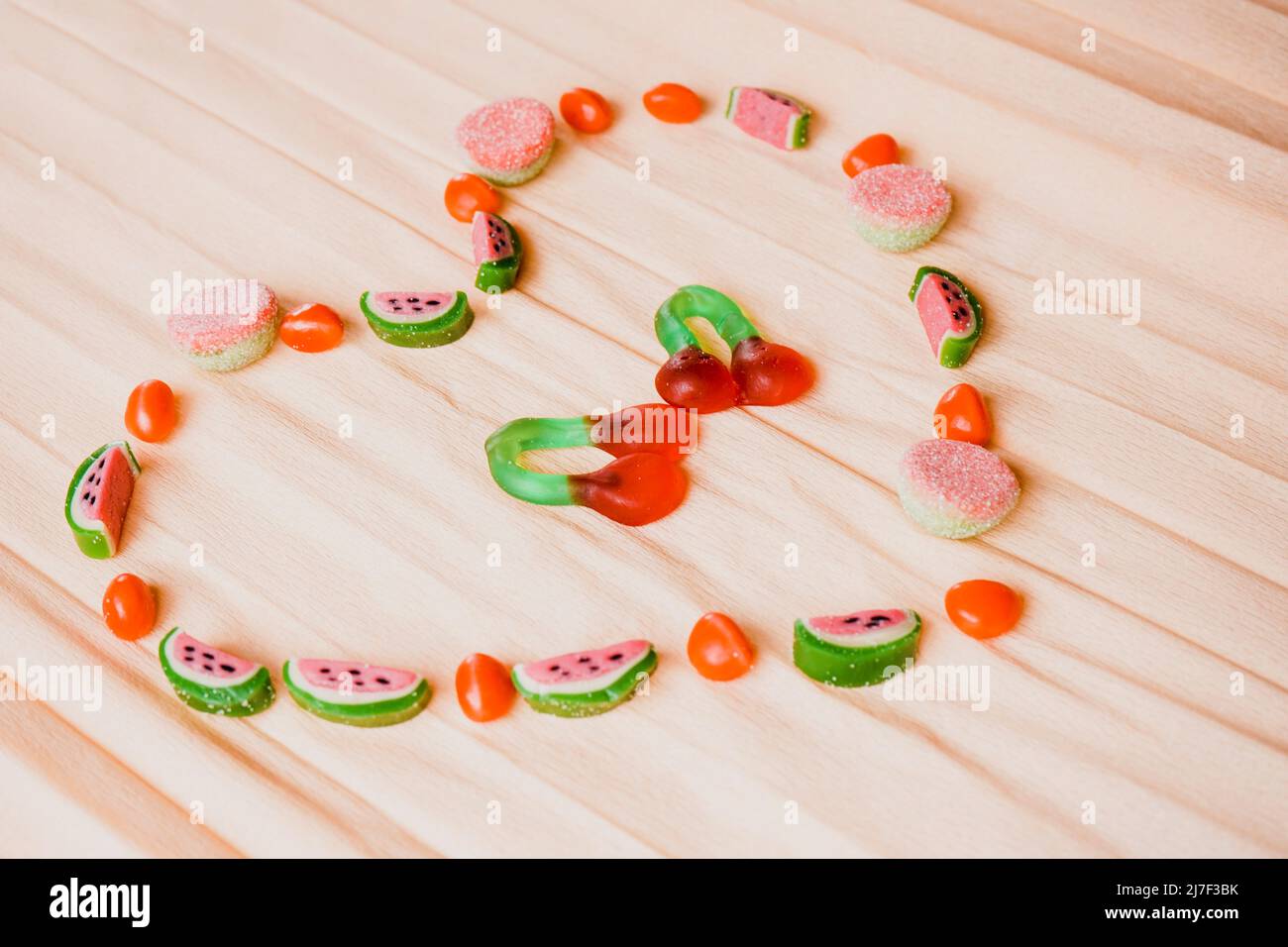 Heart shape in summer and youth atmosphere doing with fruit shaped jelly beans Stock Photo