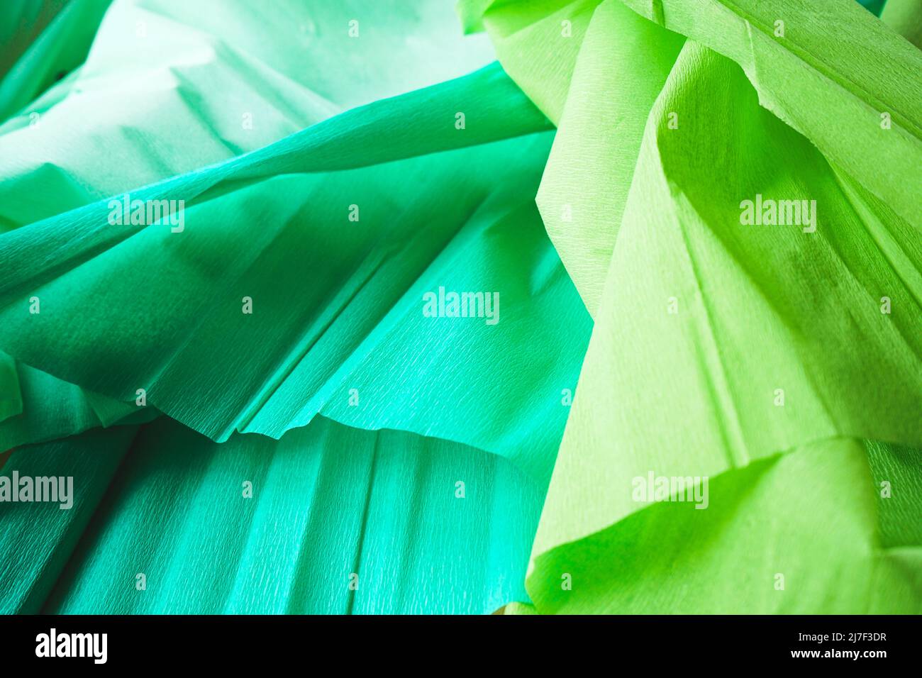Green textured image of crepe paper in green tones Stock Photo