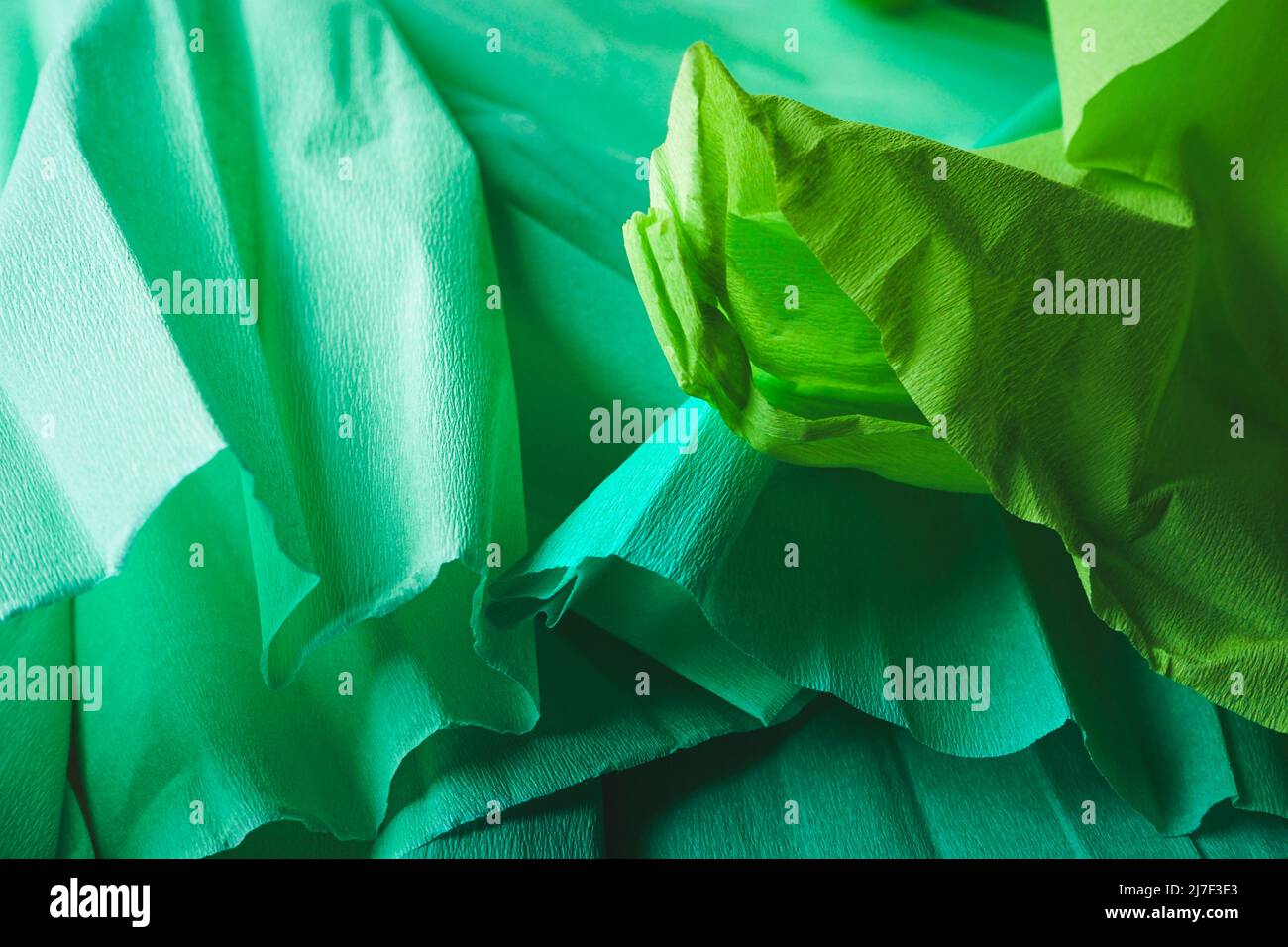 Green textured image of crepe paper in green tones Stock Photo