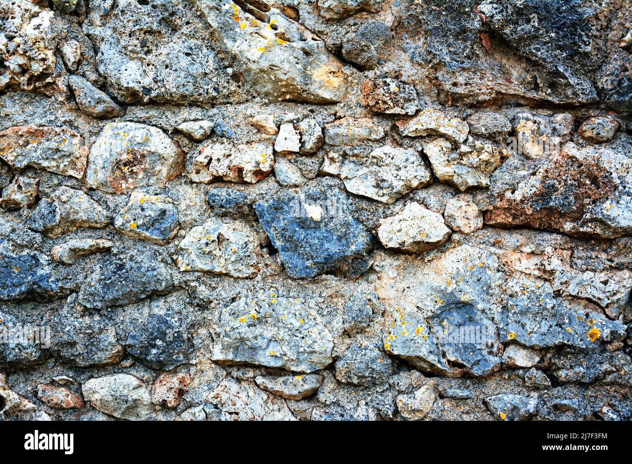 Old  bricks wall pattern. Medieval stone wall.  Background, texture Stock Photo