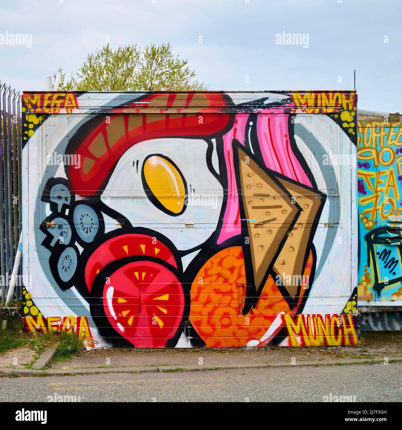 Artwork on Mega munch cafe on industrial site Stock Photo