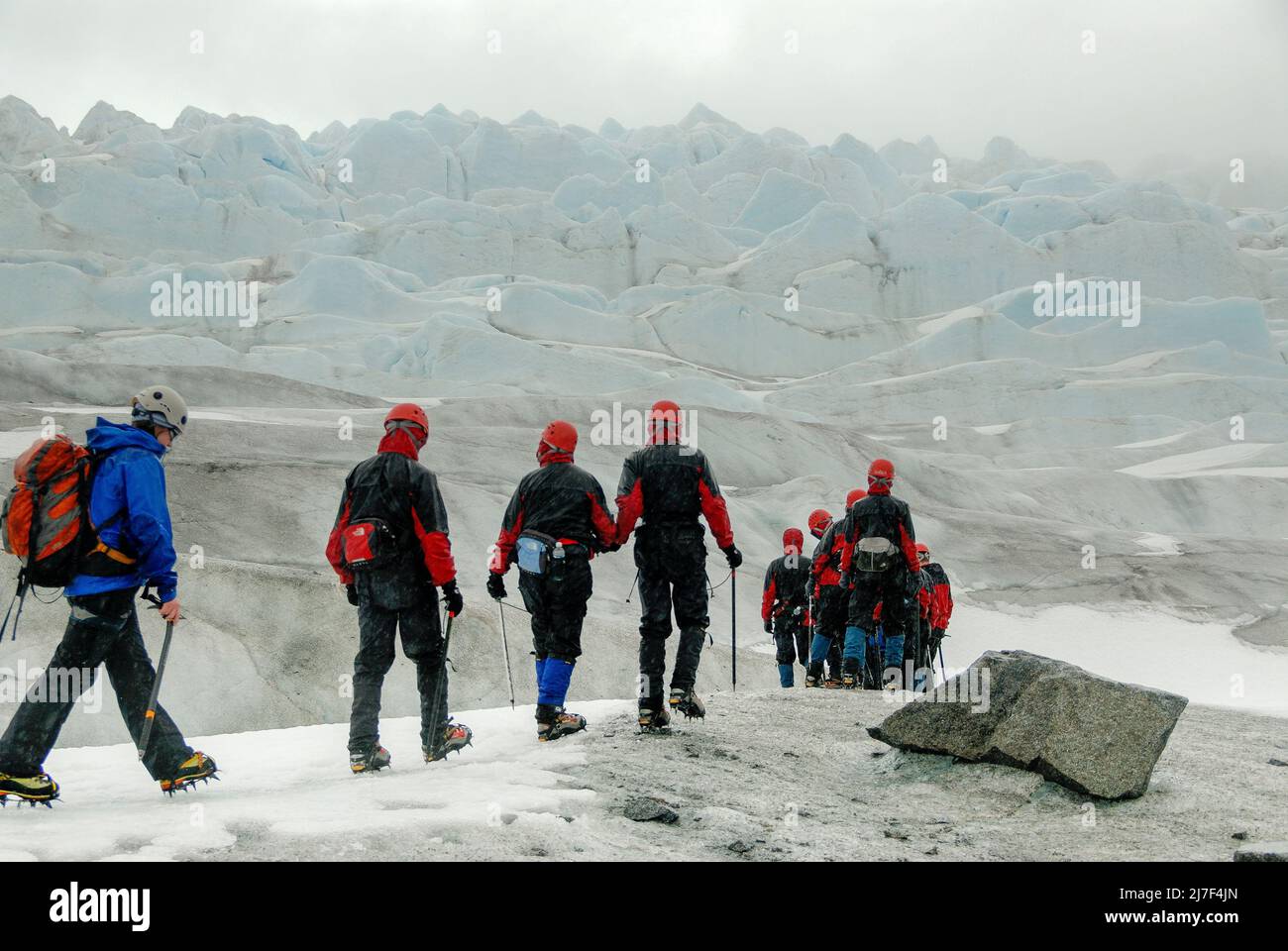 Tourists hike on Mendenhall Glacier, near Juneau. Stock Photo