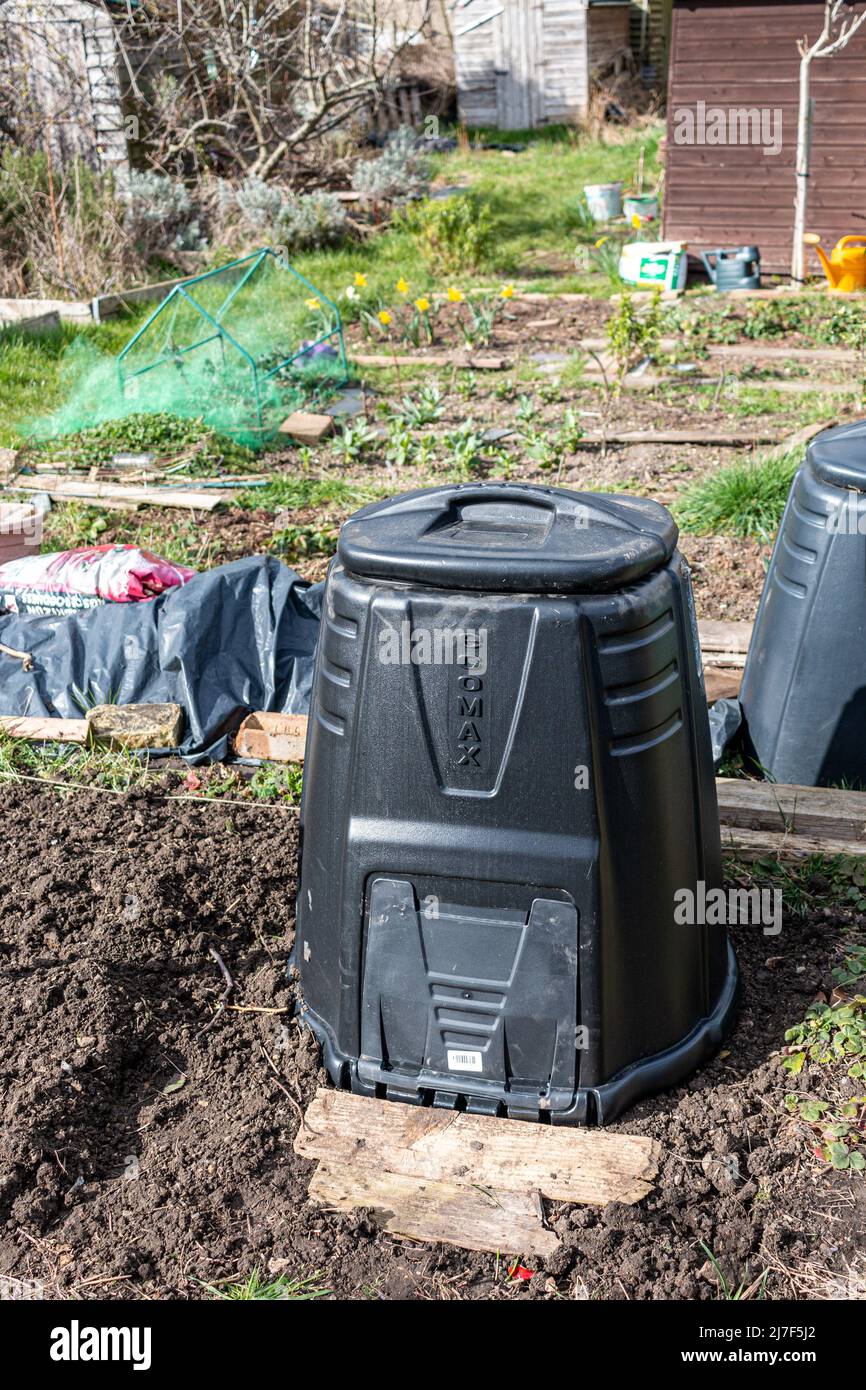 A black plastic, dalek style compost bin. Stock Photo