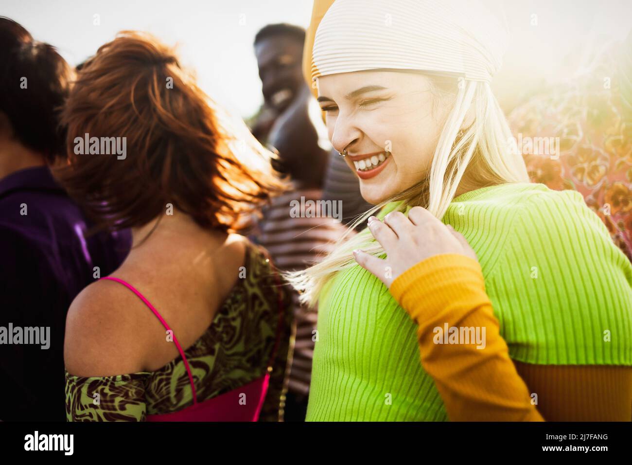 Happy young diverse friends having fun hanging out together - Youth people millennial generation concept Stock Photo