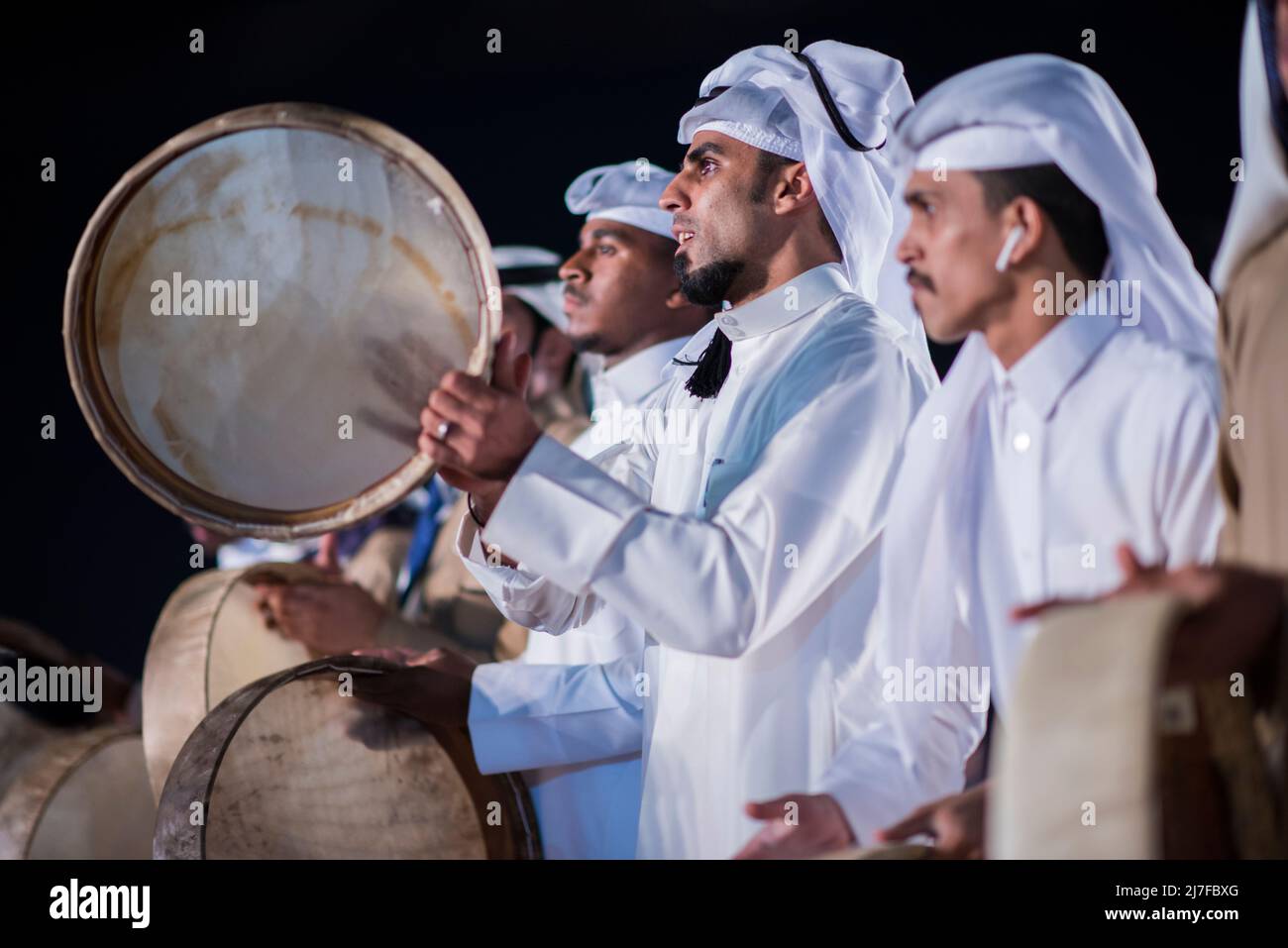 Doha, Qatar, December 18,2017: The drummers dressed in traditional clothes as part of a performance called the 'ardha' sword dance at the Darb Al Saai Stock Photo