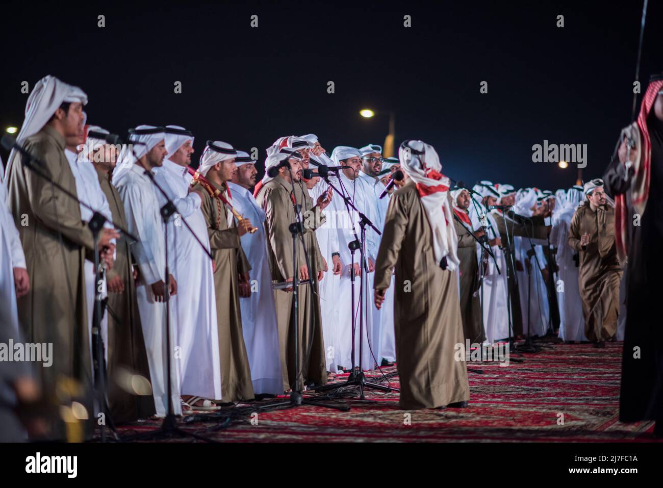Doha, Qatar, December 18,2017: The drummers dressed in traditional clothes  as part of a performance called the "ardha" sword dance at the Darb Al Saai  Stock Photo - Alamy