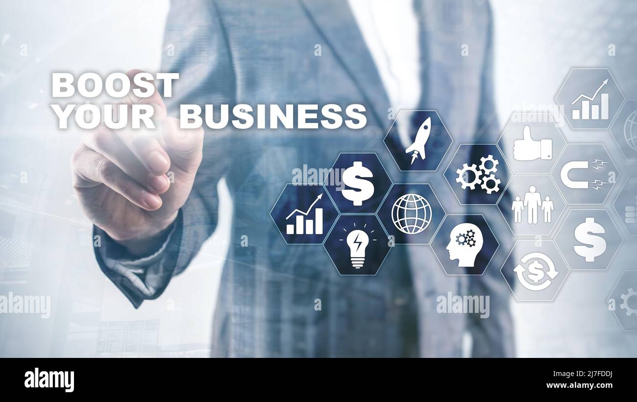Financial and Technology concept. On a virtual screen inscription: Boost Your Business Stock Photo