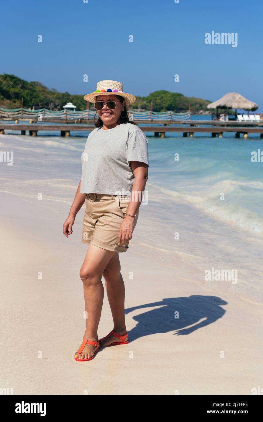 Beach mature woman enjoy sun hi-res stock photography and images - Alamy