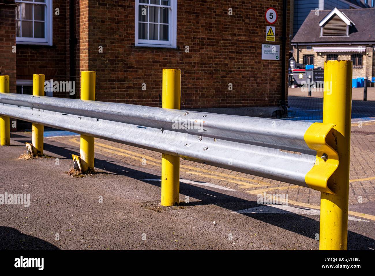 Epsom Surrey, London, May 08 2022, Car Safety Crash Barrier With Yellow Post In A Public Car Park With No People Stock Photo