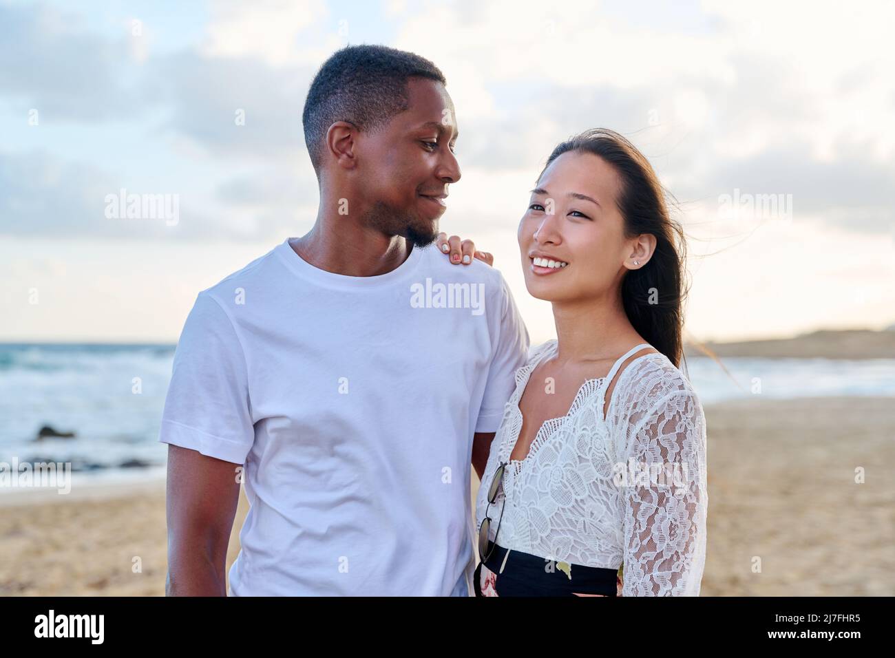 Young couple in love on the beach together. Stock Photo