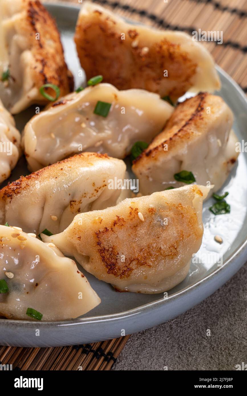 Taiwanese and Japanese Panfried gyoza dumpling jiaozi food in a plate