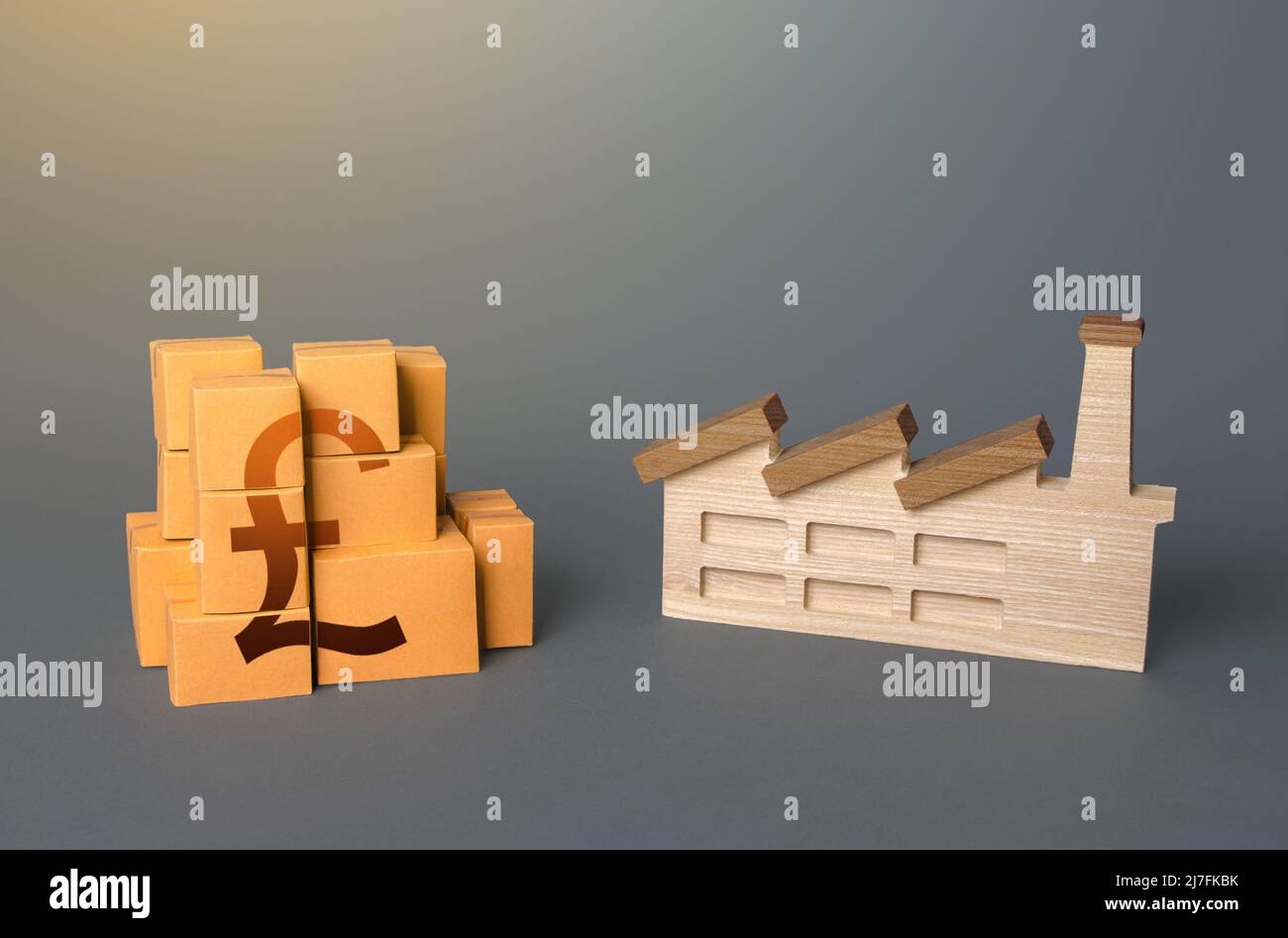 Industrial factory and british pound sterling product boxes. National economy, domestic production of goods. Logistic transportation. Support manufact Stock Photo