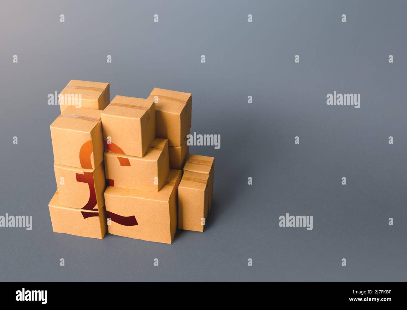 Boxes with british pound sterling symbol. Transportation logistics. Manufacturing industry and trade. Consumption economics, imports and exports. Gros Stock Photo