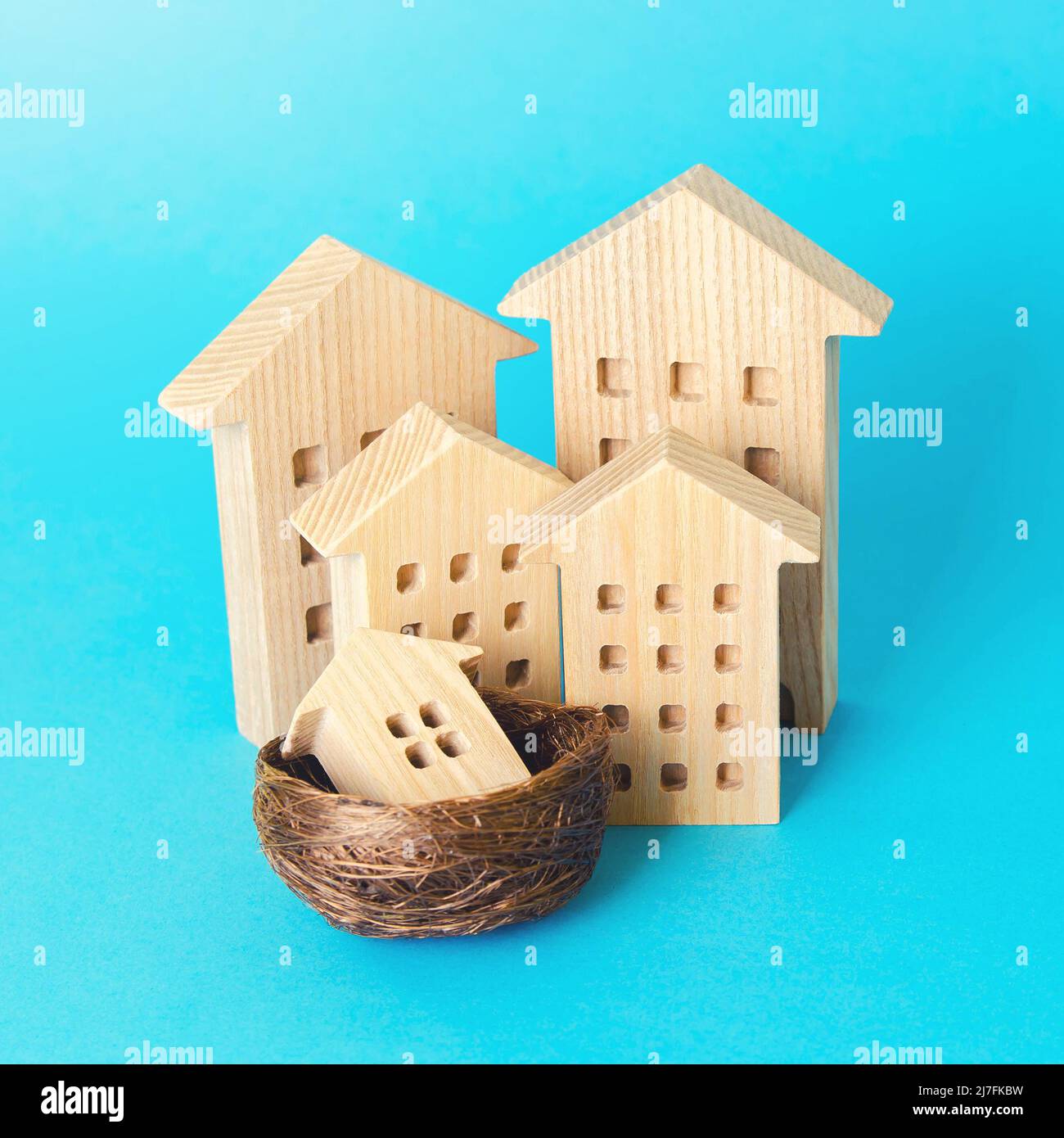 Family of houses. Parenting concept. Investing in real estate, construction industry. Mortgage. Buying a home for young families. Social support in pu Stock Photo