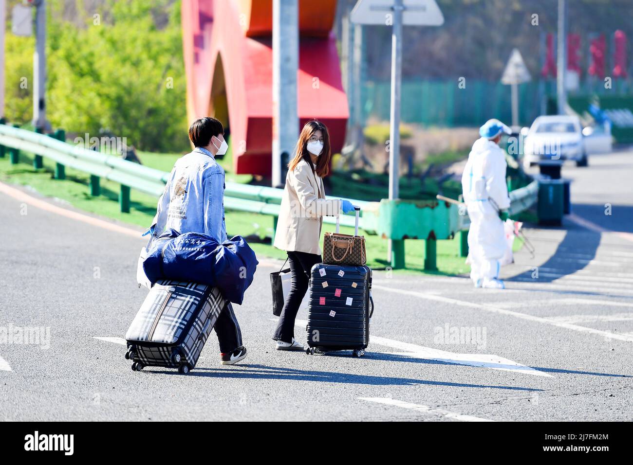 CHANGCHUN, CHINA MAY 9, 2022 University students drag their luggage