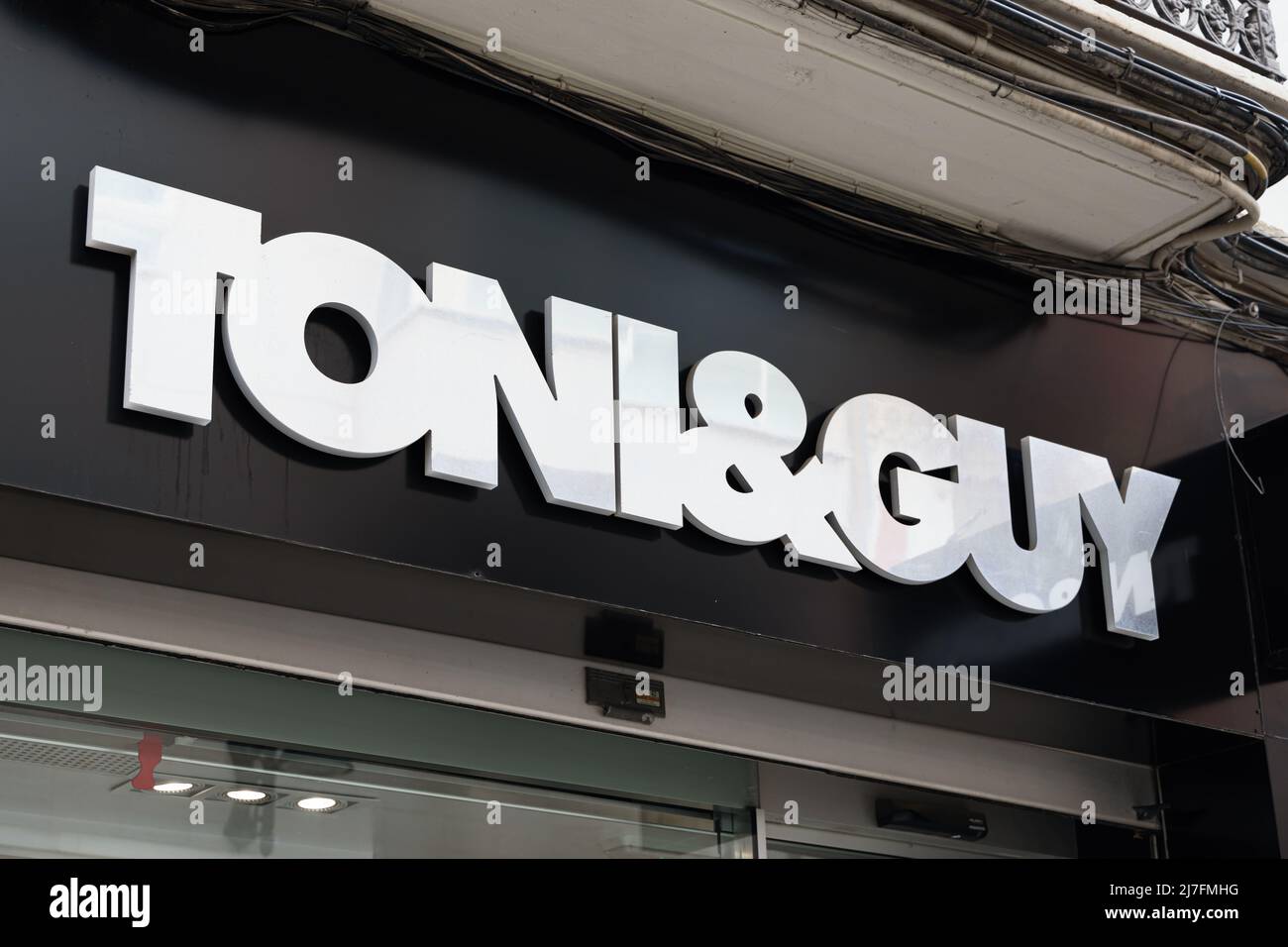 VALENCIA, SPAIN - MAY 05, 2022: Toni & Guy is a British international chain of hairdressing salons Stock Photo