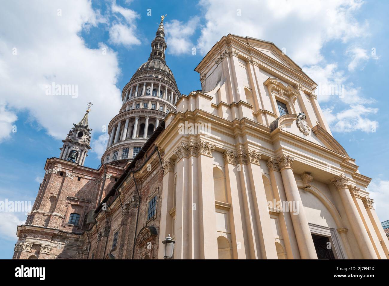 Historic center of Novara city, Italy. Novara, street Ferrari (via Ferrari) with basilica of San Gaudenzio, Piedmont region Stock Photo