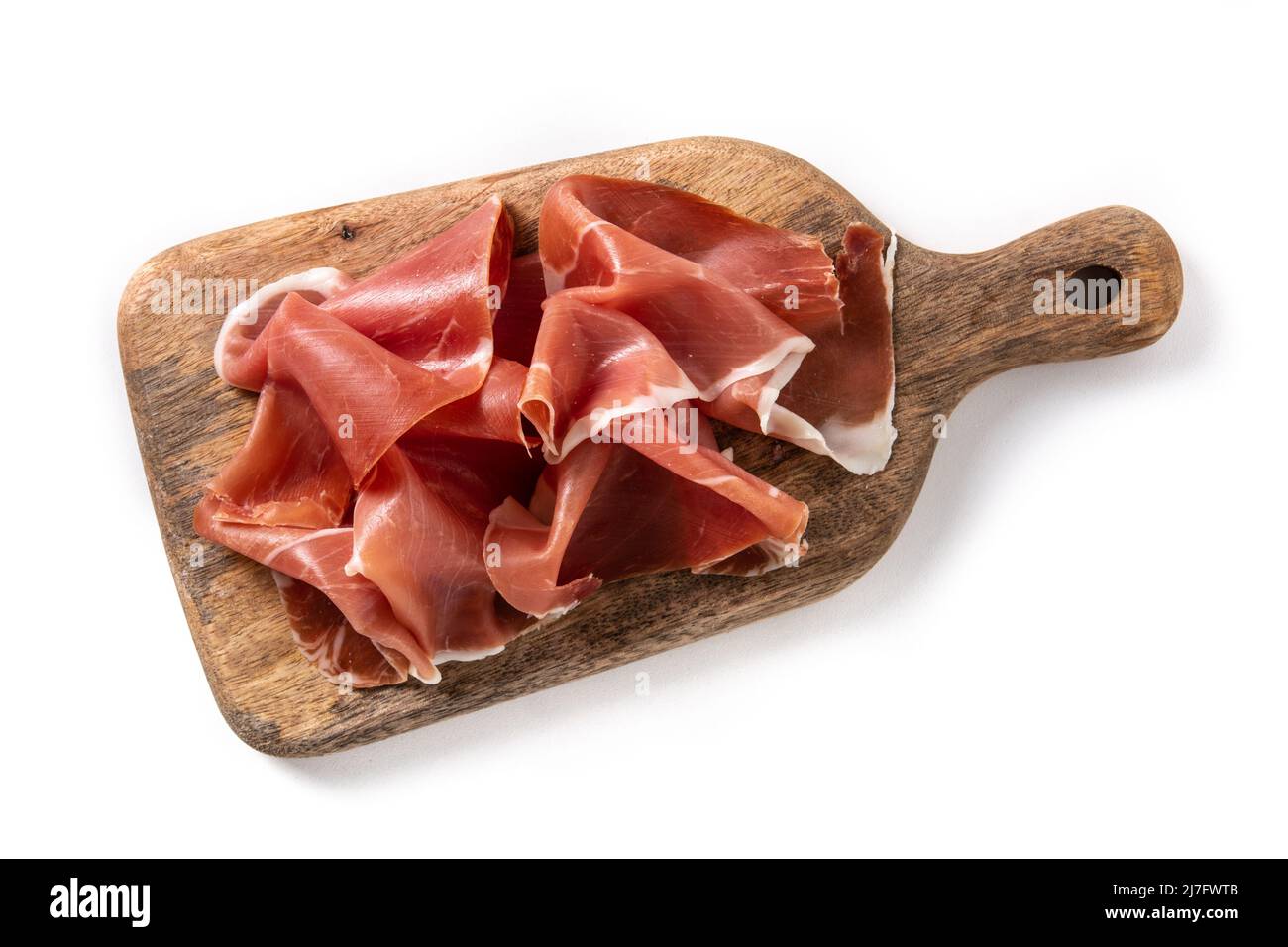 Spanish serrano ham on cutting board isolated on white background Stock