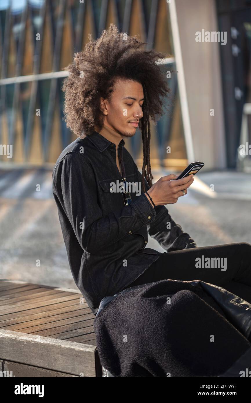 Young man talking via cell phone Stock Photo