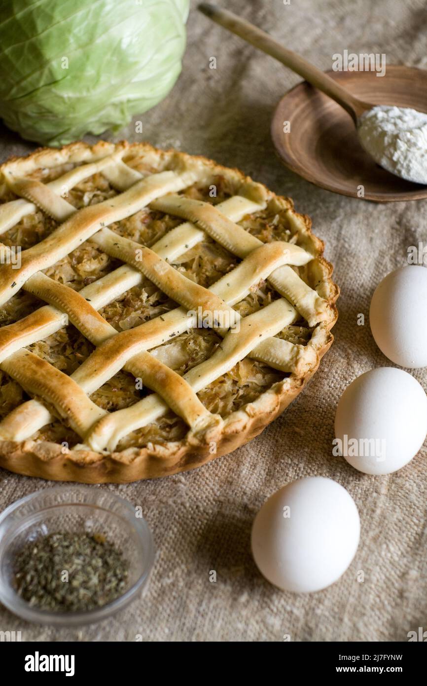 Traditional rustic vegetarian pie with cabbage and onions Stock Photo