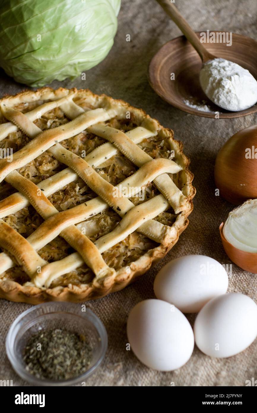 Traditional rustic vegetarian pie with cabbage and onions Stock Photo