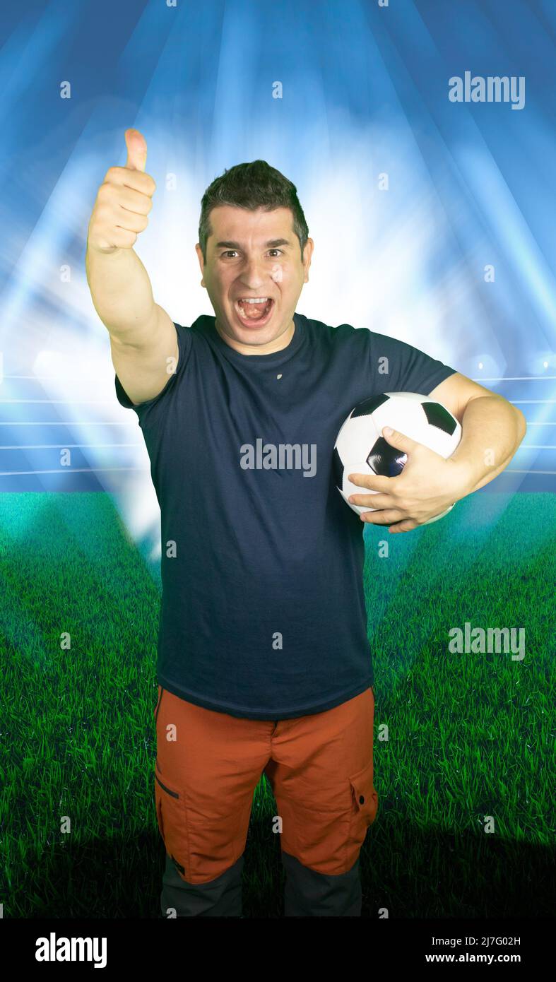 World of football fan cheering for his team happy soccer fan young adult full of joy and happiness for the final tournament cup concept Stock Photo