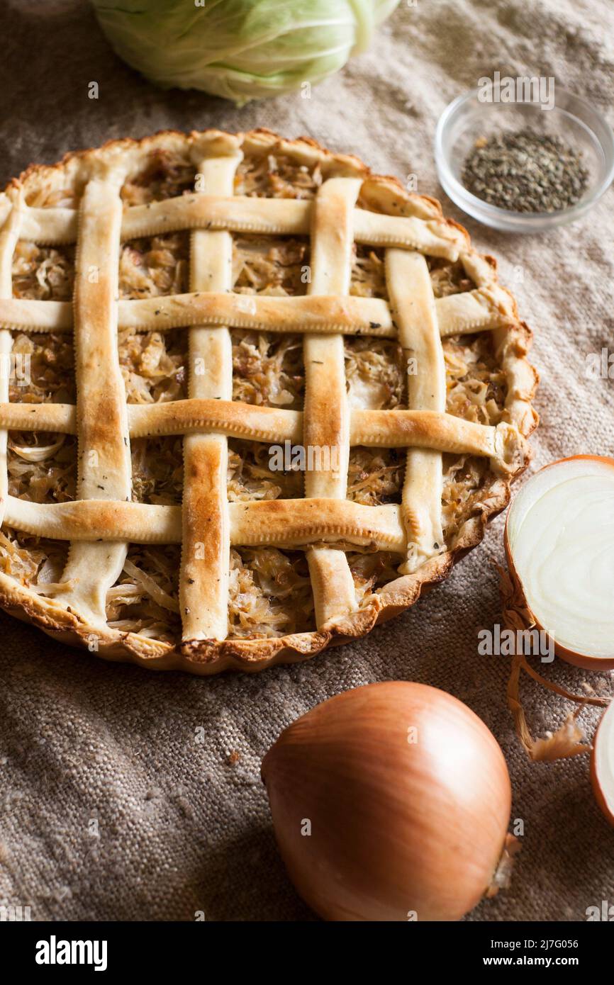 Traditional rustic vegetarian pie with cabbage and onions Stock Photo