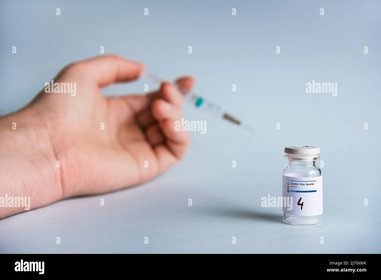 Hand holding syringe Stock Photo Alamy