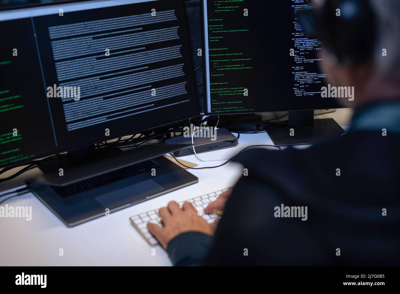 Male programmer working on computer Stock Photo - Alamy