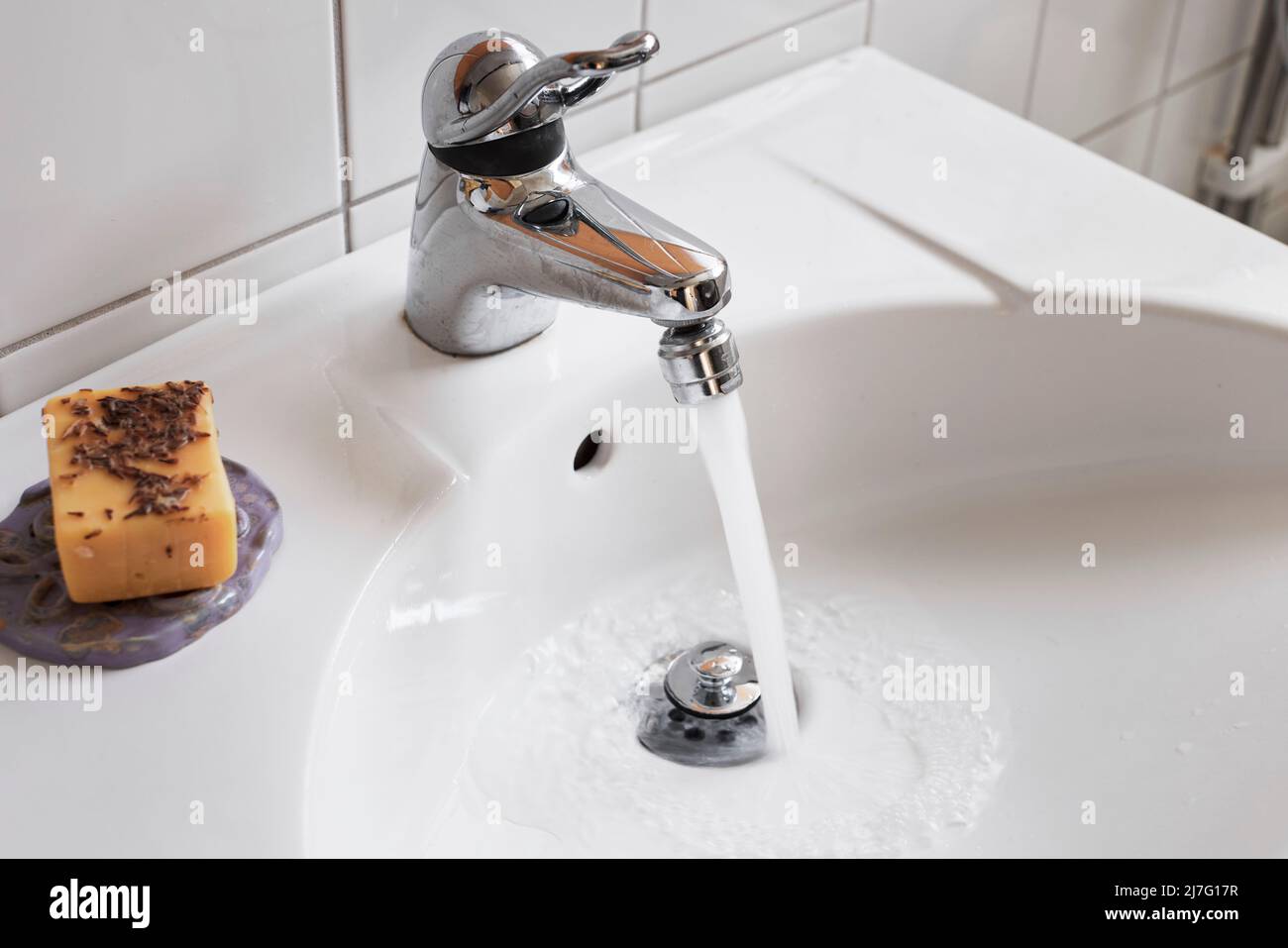Water running from bathroom tap Stock Photo Alamy